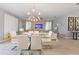 Dining area features a glass top table and white chairs at 8903 Stinger Dr, Davenport, FL 33896