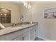 Modern bathroom with double vanity and gray countertops at 8903 Stinger Dr, Davenport, FL 33896