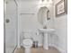Clean bathroom with pedestal sink and shower at 8903 Stinger Dr, Davenport, FL 33896