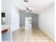 Bright living room with tiled floors, sliding glass doors, and access to the backyard at 428 Short Pine Cir, Orlando, FL 32807