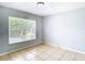Bright bedroom with tile floors and a large window at 428 Short Pine Cir, Orlando, FL 32807
