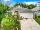 Exterior view of a house with a neatly landscaped front yard at 428 Short Pine Cir, Orlando, FL 32807