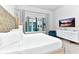 Bright bedroom with large bed and city view at 7740 Sandy Ridge Dr # 234, Reunion, FL 34747