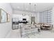 Modern kitchen with stainless steel appliances and an island at 7740 Sandy Ridge Dr # 234, Reunion, FL 34747