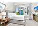Spacious bedroom with a king-size bed, large window, and ample natural light at 7740 Sandy Ridge Dr # 234, Reunion, FL 34747
