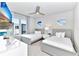 Bedroom with two beds and large window at 7740 Sandy Ridge Dr # 234, Reunion, FL 34747