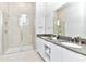 Modern bathroom with double vanity, large shower, and stylish tile at 7740 Sandy Ridge Dr # 234, Reunion, FL 34747