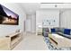 Living room with sectional sofa and large TV at 7740 Sandy Ridge Dr # 234, Reunion, FL 34747