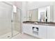 Elegant bathroom featuring double vanity, shower, and modern fixtures at 7740 Sandy Ridge Dr # 234, Reunion, FL 34747