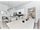 Bright dining area with seating for six and a large mirror at 7740 Sandy Ridge Dr # 234, Reunion, FL 34747