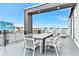 Private rooftop deck with dining area and seating at 7740 Sandy Ridge Dr # 234, Reunion, FL 34747