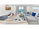 Spacious living room with sectional sofa and large TV at 7740 Sandy Ridge Dr # 234, Reunion, FL 34747
