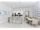 Open kitchen with island seating, modern appliances, and dining area at 7740 Sandy Ridge Dr # 234, Reunion, FL 34747