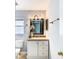 Bathroom boasts a vanity with a mirror and a lovely flower arrangement at 428 Short Pine Cir, Orlando, FL 32807