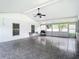 Bright screened porch with tile flooring, ceiling fan and sliding glass door at 428 Short Pine Cir, Orlando, FL 32807