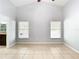 Well-lit bedroom featuring tile floors and two large windows at 428 Short Pine Cir, Orlando, FL 32807