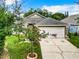 House exterior showcasing a well-maintained lawn and landscaping at 428 Short Pine Cir, Orlando, FL 32807
