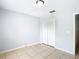 Spacious bedroom with double door closet and tile floors at 428 Short Pine Cir, Orlando, FL 32807