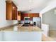 Modern kitchen with granite countertops and stainless steel appliances at 428 Short Pine Cir, Orlando, FL 32807