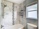 Updated bathroom with marble tile shower/tub combo at 428 Short Pine Cir, Orlando, FL 32807
