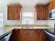 Modern kitchen with granite countertops and stainless steel appliances at 428 Short Pine Cir, Orlando, FL 32807