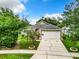 Single-story home with a garage and landscaping at 428 Short Pine Cir, Orlando, FL 32807