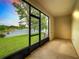Screened porch overlooking a peaceful lake view at 2543 Old Kent Cir, Kissimmee, FL 34758