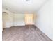 Bright living room with neutral walls and carpeting at 2543 Old Kent Cir, Kissimmee, FL 34758