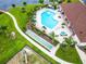 Community pool with surrounding patio and shuffleboard at 2543 Old Kent Cir, Kissimmee, FL 34758