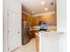 Bright kitchen features stainless steel appliances and light wood cabinets at 2543 Old Kent Cir, Kissimmee, FL 34758