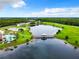 Aerial view of community pool and lake access at 2543 Old Kent Cir, Kissimmee, FL 34758