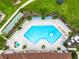 Resort-style pool with plenty of lounge chairs and a hot tub at 2543 Old Kent Cir, Kissimmee, FL 34758