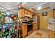 Kitchen with wood cabinets, granite countertops, and stainless steel appliances at 1759 Tallo Way, Orlando, FL 32818