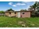 Backyard view of the house and patio area at 1759 Tallo Way, Orlando, FL 32818
