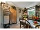 Dining area with wood table and chairs, built-in shelving and storage at 1759 Tallo Way, Orlando, FL 32818