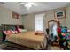 Cozy bedroom with double bed and window at 1759 Tallo Way, Orlando, FL 32818
