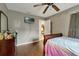 Bedroom with a bed and wood flooring at 1759 Tallo Way, Orlando, FL 32818