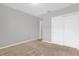 Bedroom with carpet, double doors to closet, and access to other rooms at 531 Tortugas St, Haines City, FL 33844