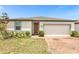 One-story home with attached garage and well-maintained landscaping at 531 Tortugas St, Haines City, FL 33844