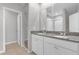Bathroom with double vanity, granite countertop, and walk-in shower at 531 Tortugas St, Haines City, FL 33844
