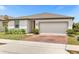 Single-story home with attached garage and brick driveway at 531 Tortugas St, Haines City, FL 33844