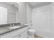 Bathroom with granite countertop and tub at 531 Tortugas St, Haines City, FL 33844