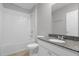 Clean bathroom with tub, shower, and granite countertop at 531 Tortugas St, Haines City, FL 33844