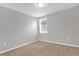 Bright bedroom with neutral walls and carpet at 531 Tortugas St, Haines City, FL 33844