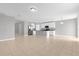 Open concept kitchen features an island and stainless steel appliances at 531 Tortugas St, Haines City, FL 33844