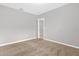 Simple bedroom with carpet and door to another room at 531 Tortugas St, Haines City, FL 33844