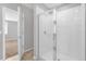 Walk-in shower with glass enclosure and tiled walls at 531 Tortugas St, Haines City, FL 33844