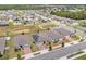 Aerial view of neighborhood with solar panels on houses at 531 Tortugas St, Haines City, FL 33844