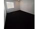 Spacious bedroom with dark carpet and window at 2222 Silver Pines Pl # 902, Orlando, FL 32808