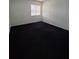 Spacious carpeted bedroom with a window and neutral walls at 2222 Silver Pines Pl # 902, Orlando, FL 32808